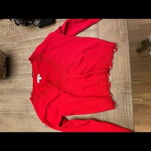 Red distressed v neck sweater